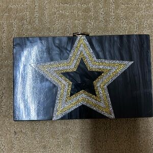 Hard black marbled clutch with gold and silver glitter star. Never used.